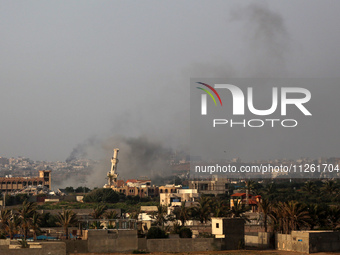 Smoke is billowing after Israeli bombardment in the central Gaza Strip on May 21, 2024, amid the ongoing conflict between Israel and the mil...