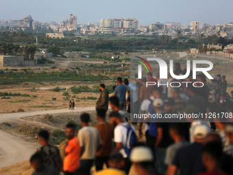 Palestinians are gathering in the hope of obtaining aid delivered into Gaza through a U.S.-built pier, amid the ongoing conflict between Isr...