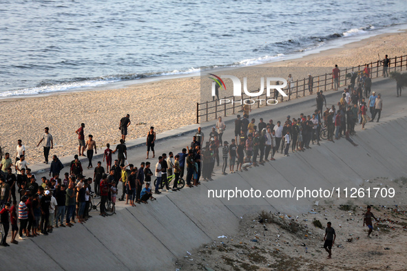 Palestinians are gathering in the hope of obtaining aid delivered into Gaza through a U.S.-built pier, amid the ongoing conflict between Isr...