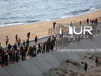 Palestinians are gathering in the hope of obtaining aid delivered into Gaza through a U.S.-built pier, amid the ongoing conflict between Isr...