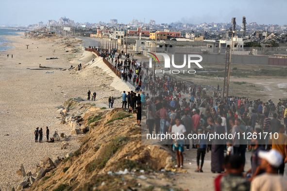 Palestinians are gathering in the hope of obtaining aid delivered into Gaza through a U.S.-built pier, amid the ongoing conflict between Isr...