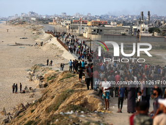 Palestinians are gathering in the hope of obtaining aid delivered into Gaza through a U.S.-built pier, amid the ongoing conflict between Isr...