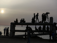 Palestinians are gathering in the hope of obtaining aid delivered into Gaza through a U.S.-built pier, amid the ongoing conflict between Isr...