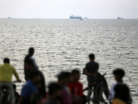 Palestinians are gathering in the hope of obtaining aid delivered into Gaza through a U.S.-built pier, amid the ongoing conflict between Isr...