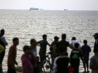 Palestinians are gathering in the hope of obtaining aid delivered into Gaza through a U.S.-built pier, amid the ongoing conflict between Isr...