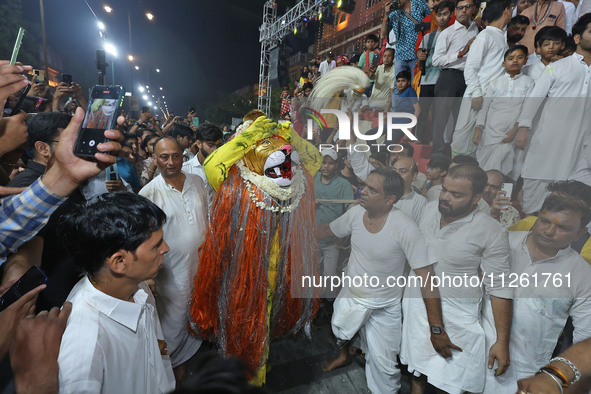 Devotees are participating in the traditional procession 'Narasimha Leela' of Lord Narasimha from Tadkeshwar Mahadev Temple on the eve of Na...