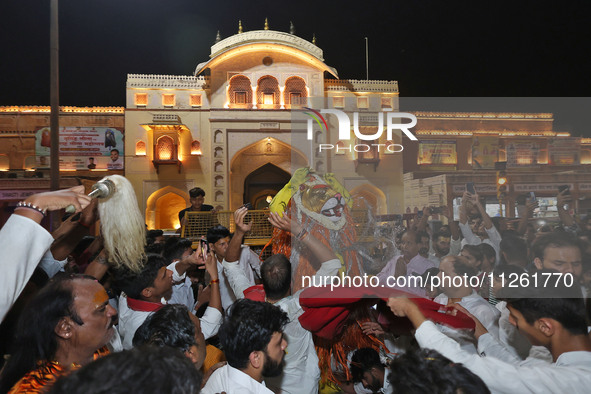 Devotees are participating in the traditional procession 'Narasimha Leela' of Lord Narasimha from Tadkeshwar Mahadev Temple on the eve of Na...