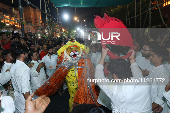 Devotees are participating in the traditional procession 'Narasimha Leela' of Lord Narasimha from Tadkeshwar Mahadev Temple on the eve of Na...