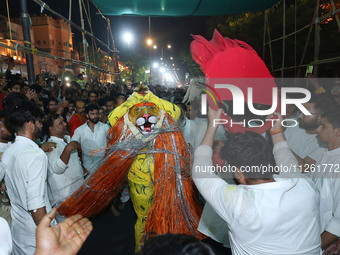 Devotees are participating in the traditional procession 'Narasimha Leela' of Lord Narasimha from Tadkeshwar Mahadev Temple on the eve of Na...