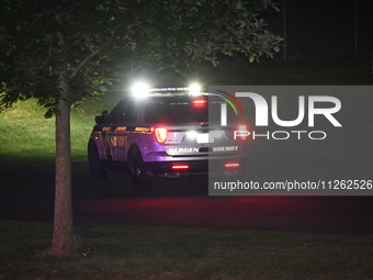 Police are present in the park. One person is wounded in a shooting in Glen Rock, New Jersey, United States, on May 21, 2024. The Bergen Cou...