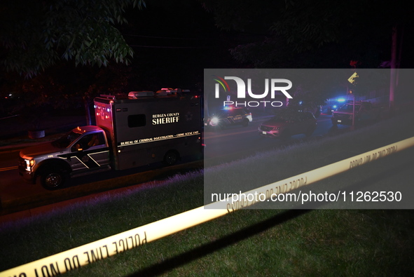 Police tape is blocking the area at the crime scene. One person is wounded in a shooting in Glen Rock, New Jersey, United States, on May 21,...