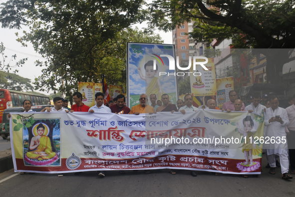 Buddhist people are taking part in a rally on the occasion of the Buddha Purnima festival, which marks the birth of Gautam Buddha, in Dhaka,...