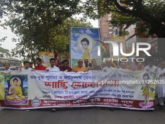 Buddhist people are taking part in a rally on the occasion of the Buddha Purnima festival, which marks the birth of Gautam Buddha, in Dhaka,...