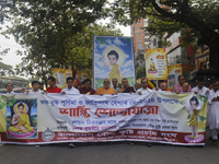 Buddhist people are taking part in a rally on the occasion of the Buddha Purnima festival, which marks the birth of Gautam Buddha, in Dhaka,...