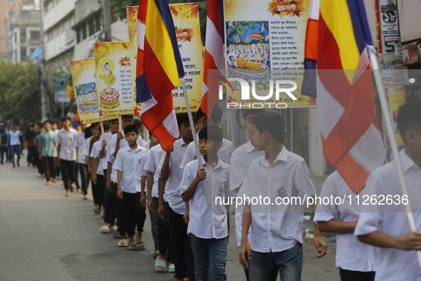 Buddhist students are taking part in a rally on the occasion of the Buddha Purnima festival, which marks the birth of Gautam Buddha, in Dhak...