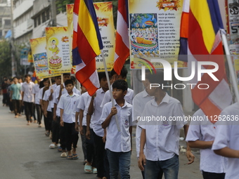 Buddhist students are taking part in a rally on the occasion of the Buddha Purnima festival, which marks the birth of Gautam Buddha, in Dhak...