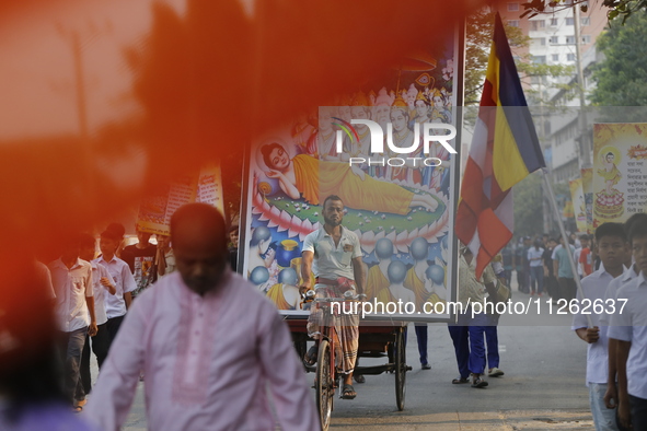 Buddhist people are taking part in a rally on the occasion of the Buddha Purnima festival, which marks the birth of Gautam Buddha, in Dhaka,...