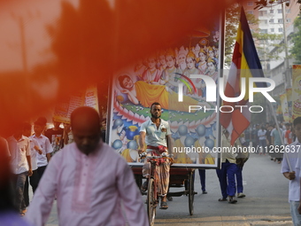 Buddhist people are taking part in a rally on the occasion of the Buddha Purnima festival, which marks the birth of Gautam Buddha, in Dhaka,...