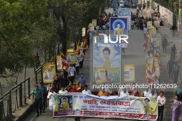 Buddhist people are taking part in a rally on the occasion of the Buddha Purnima festival, which marks the birth of Gautam Buddha, in Dhaka,...