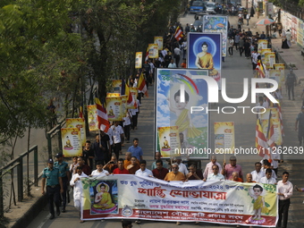 Buddhist people are taking part in a rally on the occasion of the Buddha Purnima festival, which marks the birth of Gautam Buddha, in Dhaka,...