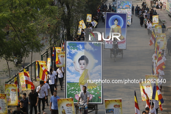 Buddhist people are taking part in a rally on the occasion of the Buddha Purnima festival, which marks the birth of Gautam Buddha, in Dhaka,...