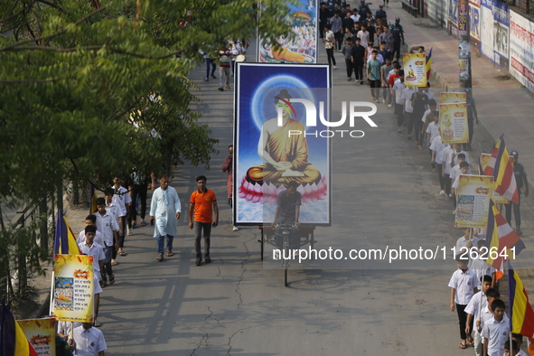 Buddhist people are taking part in a rally on the occasion of the Buddha Purnima festival, which marks the birth of Gautam Buddha, in Dhaka,...