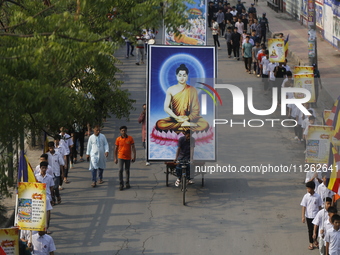 Buddhist people are taking part in a rally on the occasion of the Buddha Purnima festival, which marks the birth of Gautam Buddha, in Dhaka,...