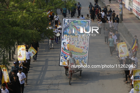 Buddhist people are taking part in a rally on the occasion of the Buddha Purnima festival, which marks the birth of Gautam Buddha, in Dhaka,...