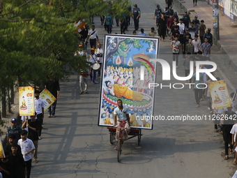 Buddhist people are taking part in a rally on the occasion of the Buddha Purnima festival, which marks the birth of Gautam Buddha, in Dhaka,...