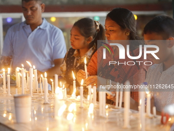 Buddhist devotees are lighting candles at a temple on the occasion of the Buddha Purnima festival, which marks the birth of Gautam Buddha, i...