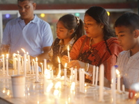 Buddhist devotees are lighting candles at a temple on the occasion of the Buddha Purnima festival, which marks the birth of Gautam Buddha, i...