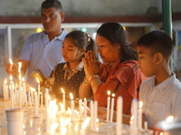 Buddhist devotees are lighting candles at a temple on the occasion of the Buddha Purnima festival, which marks the birth of Gautam Buddha, i...