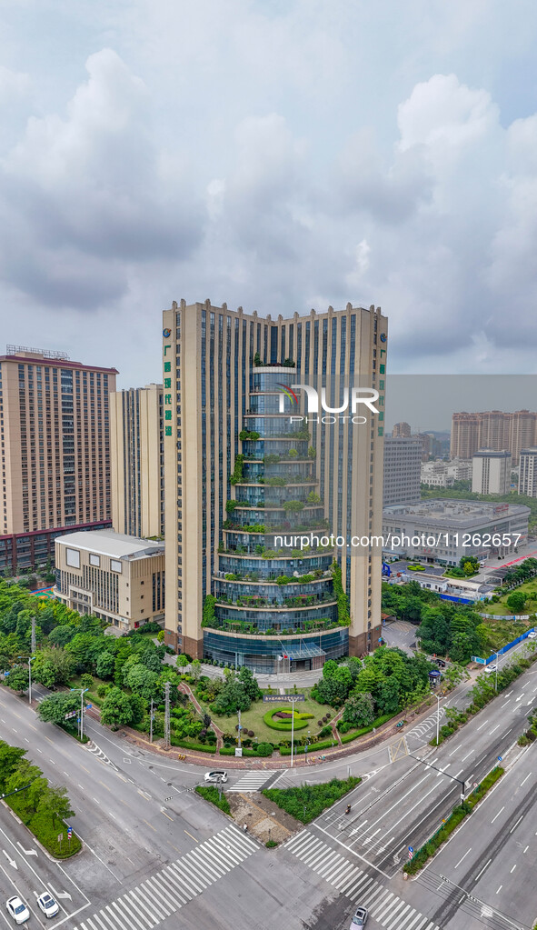 A 12-storey building in Nanning, China, on May 21, 2024, is looking like layers of stacked cakes. Because of the various green vegetation pl...