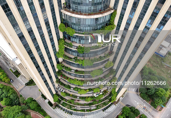 A 12-storey building in Nanning, China, on May 21, 2024, is looking like layers of stacked cakes. Because of the various green vegetation pl...