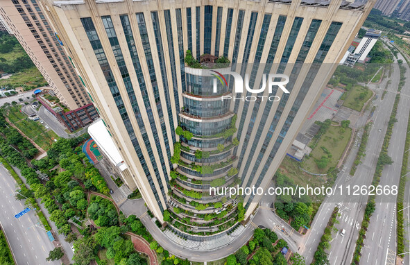 A 12-storey building in Nanning, China, on May 21, 2024, is looking like layers of stacked cakes. Because of the various green vegetation pl...