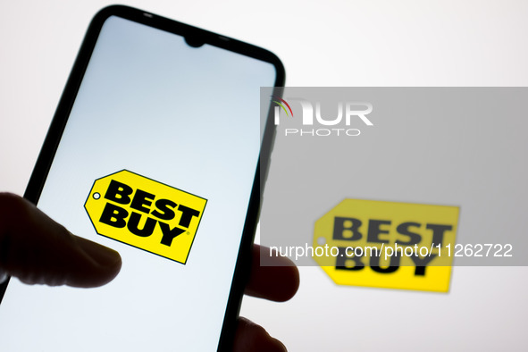 The Best Buy logo is being displayed on a smartphone screen and on a computer screen in Athens, Greece, on May 22, 2024. 