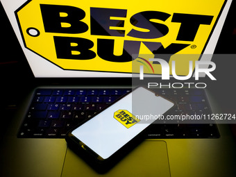 The Best Buy logo is being displayed on a smartphone screen and on a computer screen in Athens, Greece, on May 22, 2024. (