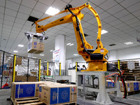 A robot is making an order for textile chemical fiber on a production line in Fuzhou, Fujian province, China, on May 22, 2024. (