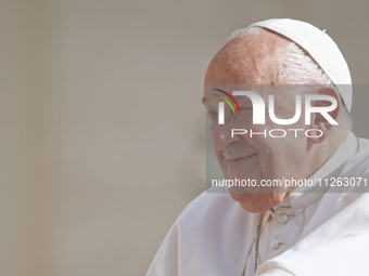 Pope Francis is smiling during his weekly general audience in Vatican City, on May 22, 2024. (