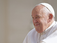 Pope Francis is smiling during his weekly general audience in Vatican City, on May 22, 2024. (