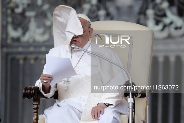 Winds are moving Pope Francis' pellegrina as he is leading his weekly General Audience in Saint Peter's Square, Vatican City, on May 22, 202...