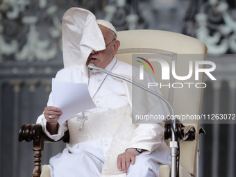 Winds are moving Pope Francis' pellegrina as he is leading his weekly General Audience in Saint Peter's Square, Vatican City, on May 22, 202...