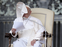 Winds are moving Pope Francis' pellegrina as he is leading his weekly General Audience in Saint Peter's Square, Vatican City, on May 22, 202...