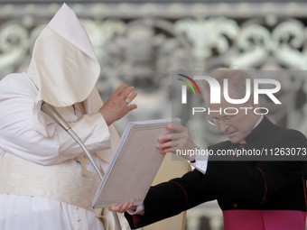 Winds are moving Pope Francis' pellegrina as he is leading his weekly General Audience in Saint Peter's Square, Vatican City, on May 22, 202...