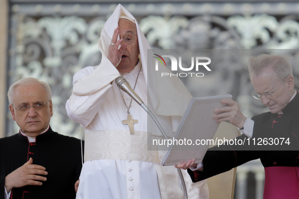 Winds are moving Pope Francis' pellegrina as he is leading his weekly General Audience in Saint Peter's Square, Vatican City, on May 22, 202...