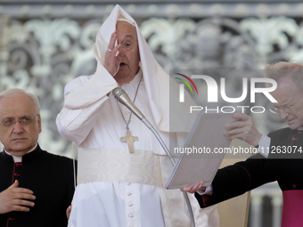 Winds are moving Pope Francis' pellegrina as he is leading his weekly General Audience in Saint Peter's Square, Vatican City, on May 22, 202...