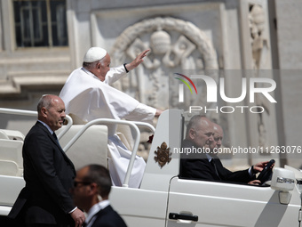 Pope Francis is leaving St. Peter's Square at the end of his weekly general audience in Vatican City, on May 22, 2024. (