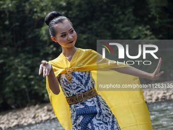 Dancers are performing a traditional dance during the Fang Sen ritual, or releasing animals into nature, as part of a series of worship ahea...