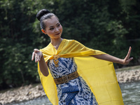 Dancers are performing a traditional dance during the Fang Sen ritual, or releasing animals into nature, as part of a series of worship ahea...