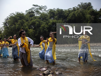 Dancers are performing a traditional dance during the Fang Sen ritual, or releasing animals into nature, as part of a series of worship ahea...